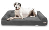 A Great Dane is happy and laying on a charcoal sofa edition of a Big Barker dog bed