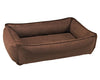The cowboy urban lounger dog bed from bowsers is brown colored leather. It has four bolsters and each is padded