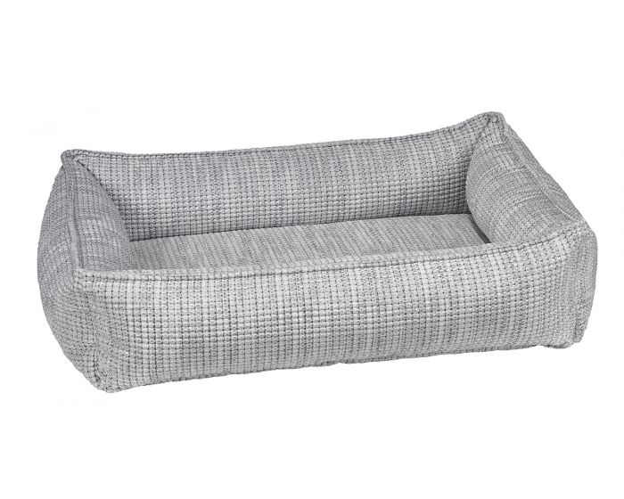 The glacier urban lounger dog bed from bowsers is light gray with a checkered material throughout