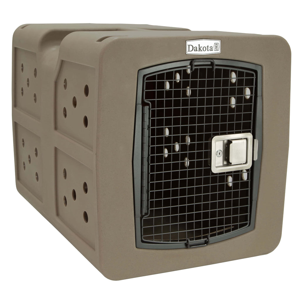The coyote dakota 283 kennel. Coyote is a dusty brown color with its circular holes visible on the left side 