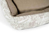 The corner of country chase bed shows the tan interior and the hand sewn bolsters. The padding in the bolsters is full.