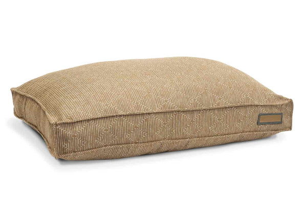 Golden doodle houndry lounger dog bed is yellow acorn colored with white diamond etching on fabric. Plush and poofy, the center has the most padding. 