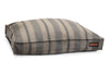 The Irish Wolfhound Houndry Lounger bed is a warm gray color with navy stripes. The stripes are wide and thin stripes, alternating from thing and wide